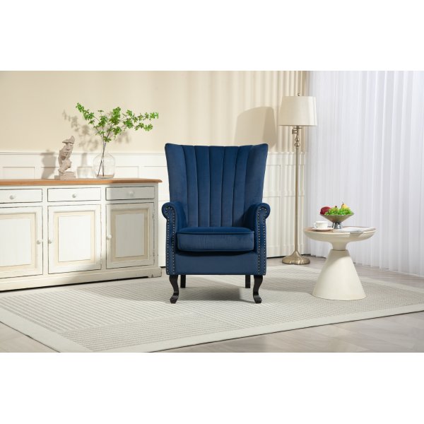 Öronlappsfåtölj i blått sammet Öronlappsfåtölj i blått sammet