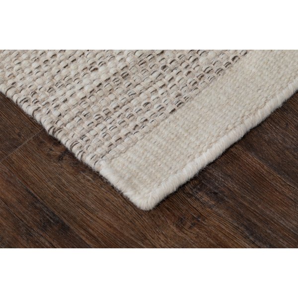 Tapis tuft en laine tiss main Crme