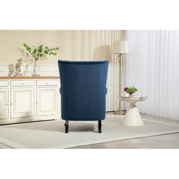 Öronlappsfåtölj i blått sammet Öronlappsfåtölj i blått sammet